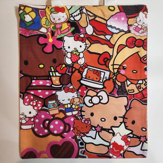 A fabric tote bag featuring a dense, colorful collage print of Hello Kitty characters in various poses and outfits, set against a plain light background.